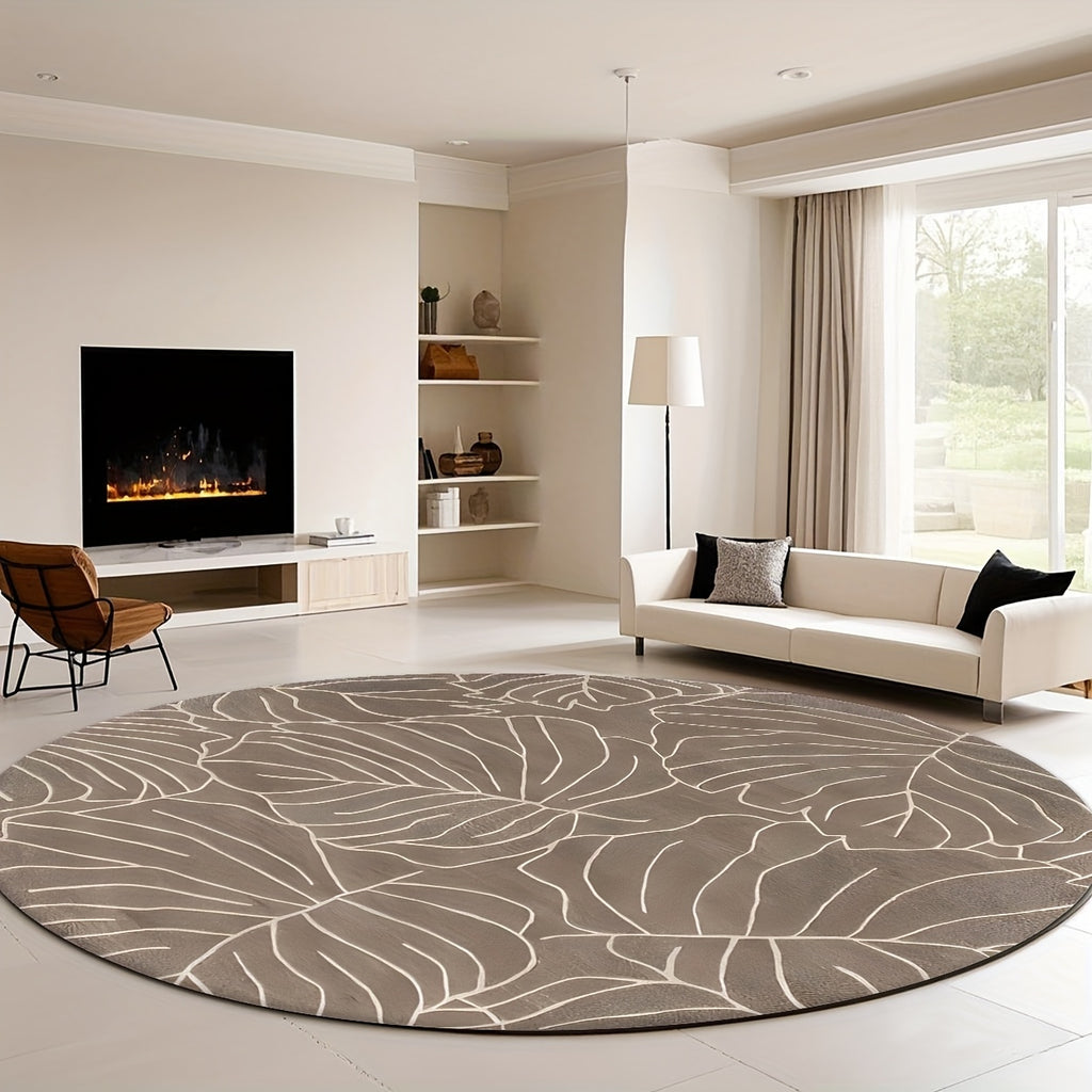 Tapis rond taupe aux grandes feuilles de monstera crème