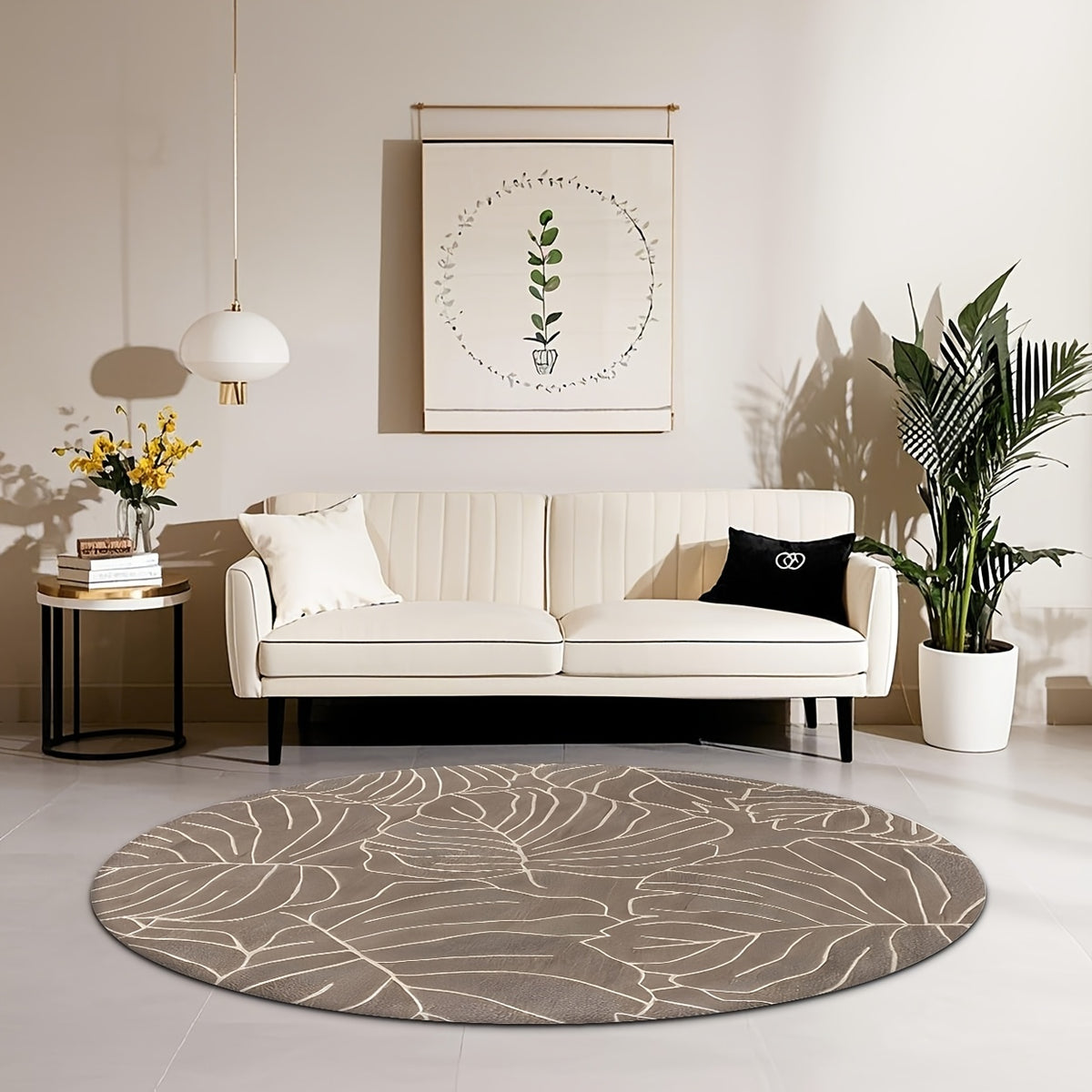 Tapis rond taupe aux grandes feuilles de monstera crème