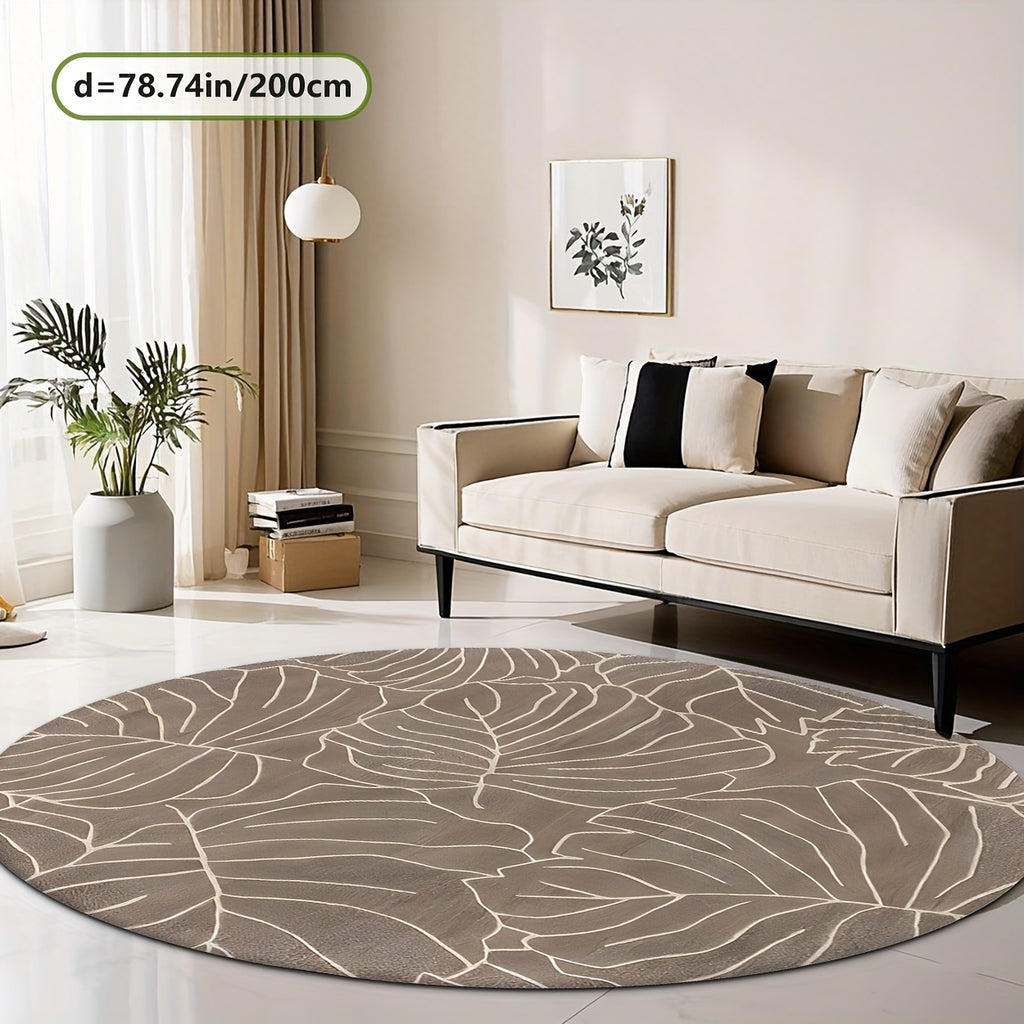 Tapis rond taupe aux grandes feuilles de monstera crème