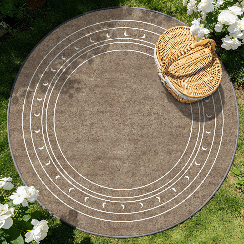 Tapis rond taupe à phases de lune et fins cercles ivoire