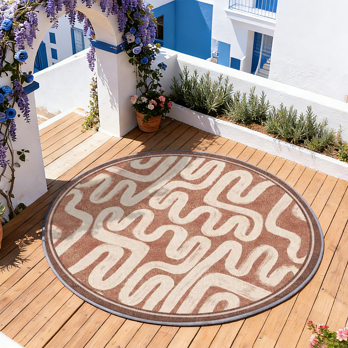 Tapis rond terracotta à serpentins crème et bordure large