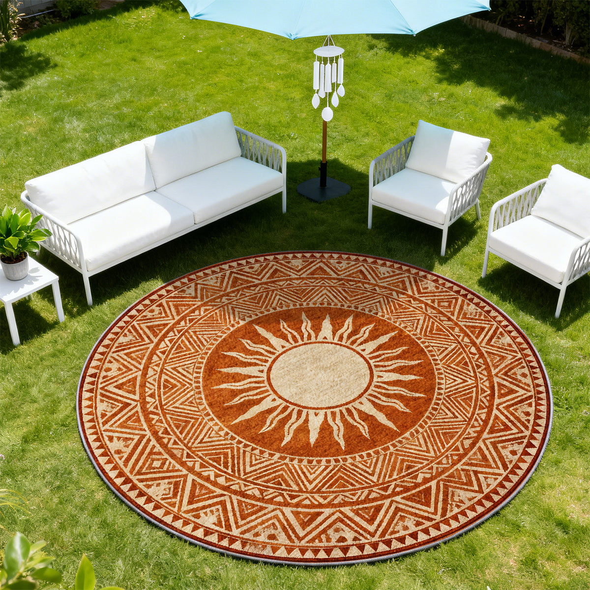 Tapis rond terracotta à soleil ethnique et frises ocre fines