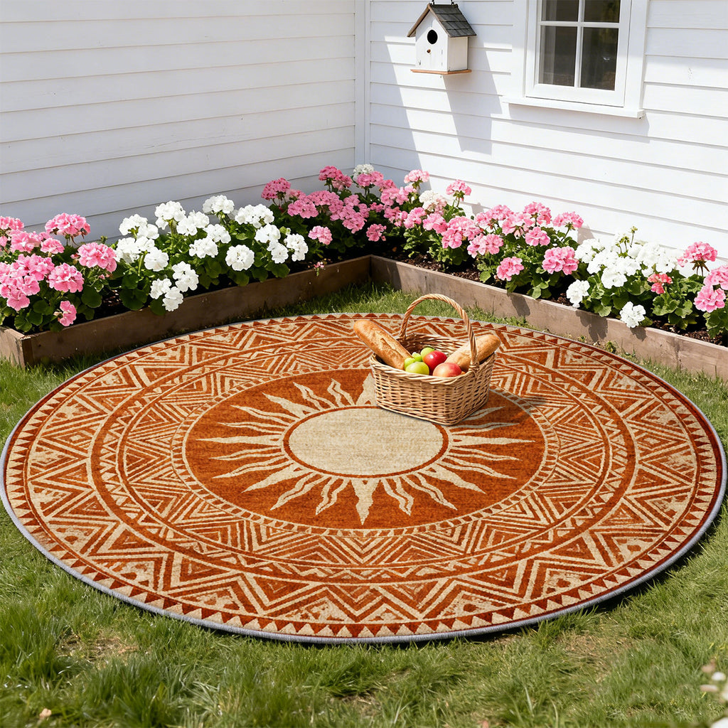 Tapis rond terracotta à soleil ethnique et frises ocre fines