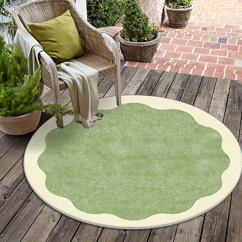 Tapis rond vert sauge à bord festonné crème, dos à points